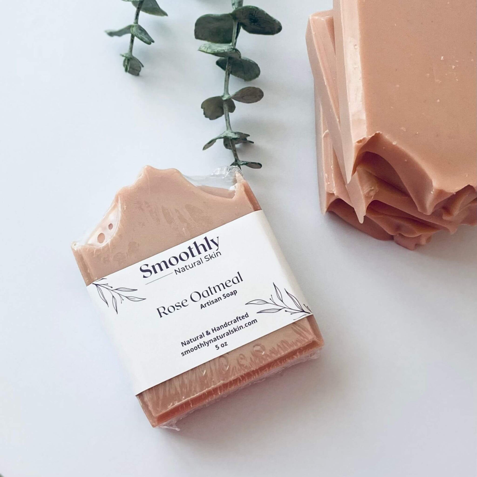 Natural handcrafted rose oatmeal soap, designed to exfoliate and hydrate the skin with the calming properties of rose and the soothing texture of oatmeal. 